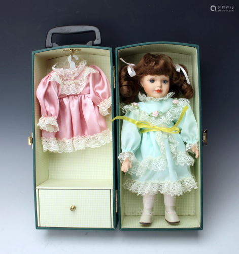 ANTIQUE DOLL WITH CLOTHES IN CARRY CASE
