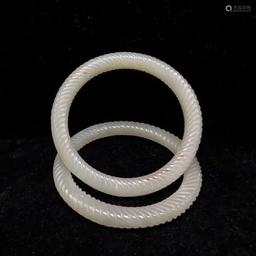 A Pair Of Carved White Jade Bangle