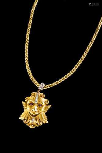 A long chain with classical mask pendant