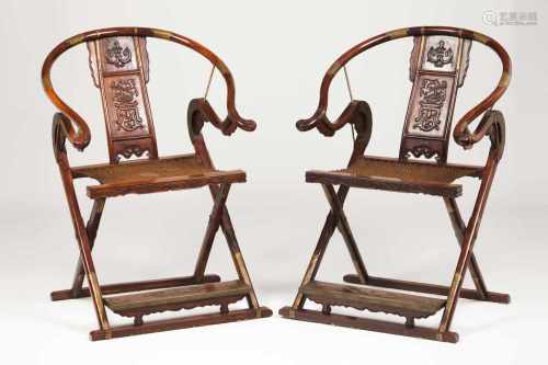 A pair of folding chairs