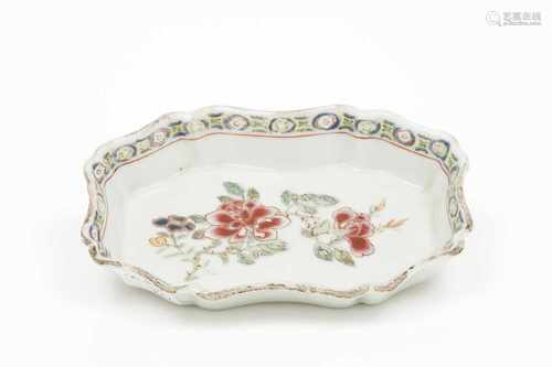 A small scalloped saucer