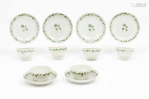 A set of six bowls and saucers