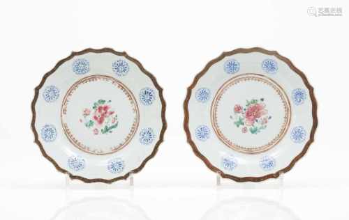 A pair of scalloped plates