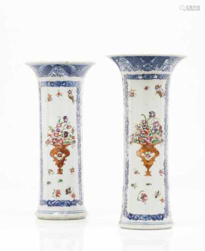 A pair of cylindrical vases