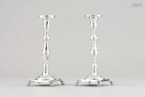 A pair of candle stands