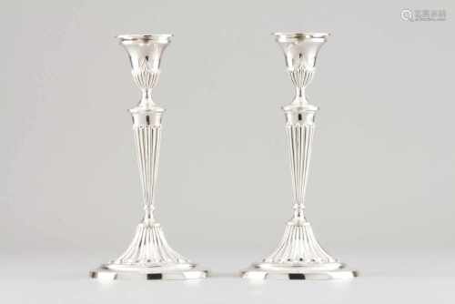 A pair of D.Maria candlesticks