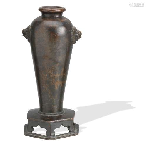A bronze vase on integral stand 17th/18th century