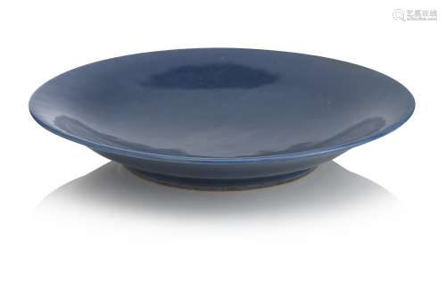 A large powder blue saucer dish Qianlong seal mark in underglaze blue but later
