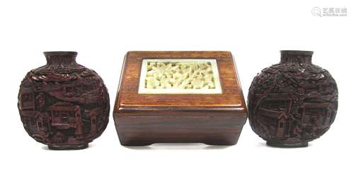 Two cinnabar lacquer-style snuff bottles and a small hardwood box inset with jade