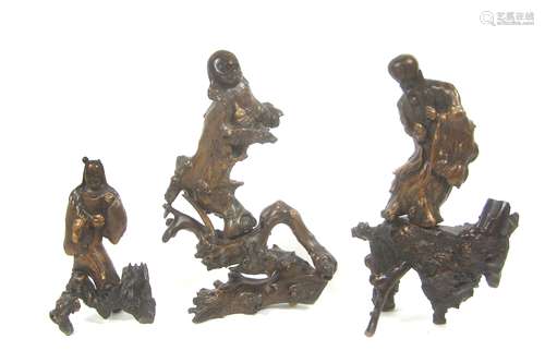 Three rootwood carvings of Daoist Immortals 19th century (5)