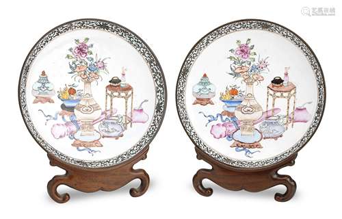 A pair of Canton enamel saucer dishes with wood display stands Qing Dynasty, 19th century