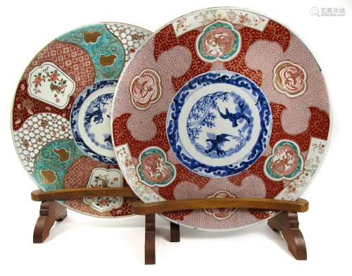 A matched pair of Imari chargers on wooden stands Late 19th century (4)