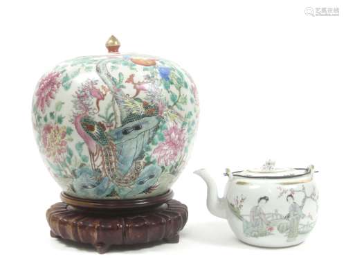 A famille rose jar and cover on hardwood stand and a famille rose teapot Late 19th and 20th centu...