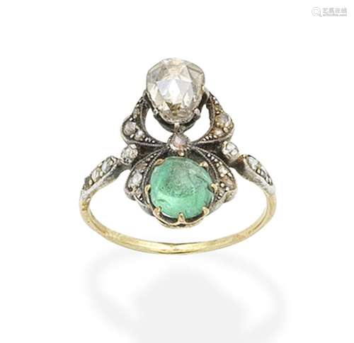 An emerald and diamond ring