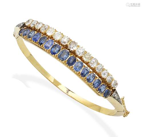 A late 19th century sapphire and diamond bangle