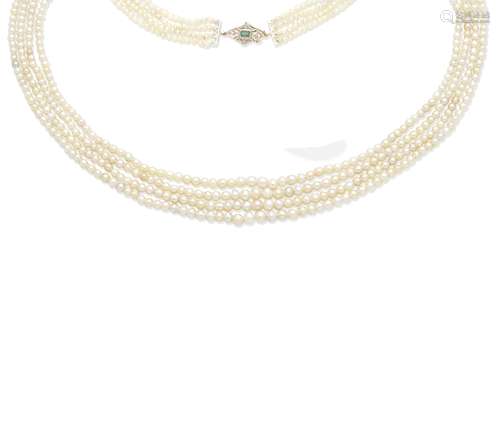 A natural pearl necklace with an emerald and diamond clasp,