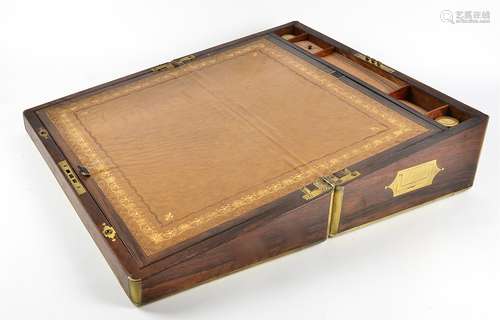 A Victorian rosewood writing slope with brass mountings, a fitted interior containing two lidded