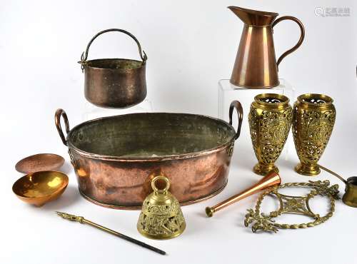 A copper tray of substantial proportions, diameter 70cm, together with a pair of pierced brass vases