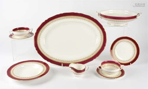 A Royal Worcester 'Regency' pattern part dinner service, in red, consisting of 7 large plates, 8