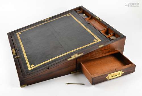 A Victorian rosewood writing slope with brass mountings, a fitted interior containing two lidded