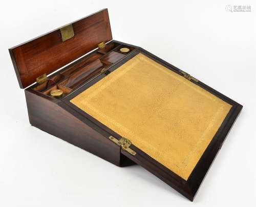 A Victorian rosewood writing slope with brass mountings and inlay, a fitted interior containing