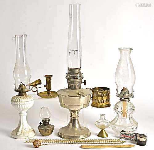 Three 20th Century oil lamps, with ceramic, glass and metal bodies, with shells and chimneys,