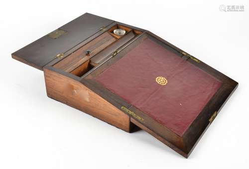 A Victorian rosewood writing slope, with mother of pearl inlays, fitted interior containing one