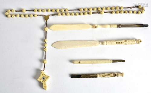 A collection of bone Stanhopes, chain 38cm (5)