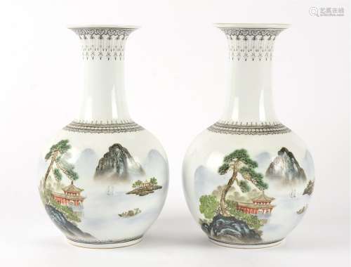 A pair of Chinese 20th Century vases, each bulbous body with polychrome overglaze enamel mountainous