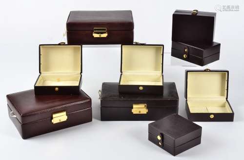 A large collection of jewellery boxes, red or brown leather covering with cream suede interior and