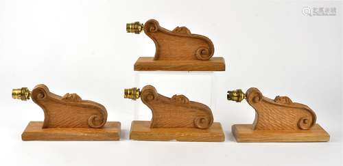 Four Robert Thompson of Kilburn 'Mouseman' oak wall light brackets, rectangular mounting plate