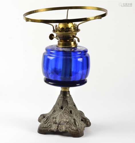 An oil lamp with blue glass reservoir, a frosted shade and chimney, marked 'Duplex' made in England,