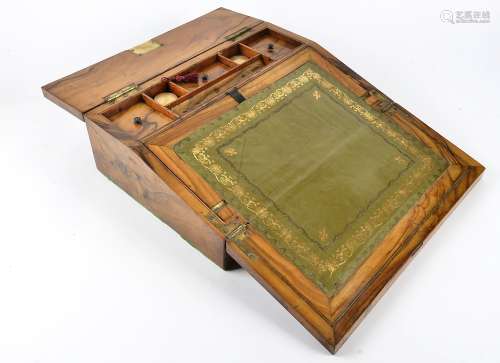 A Victorian walnut writing slope, inlaid with mother of pearl, a fitted interior containing two