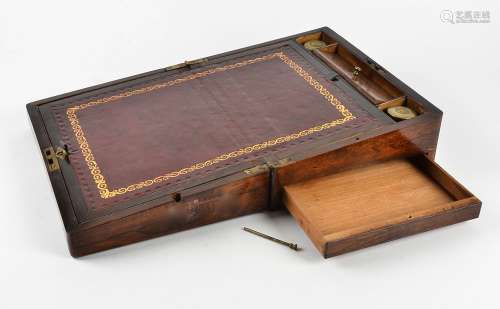 A Victorian rosewood writing slope, with mother of pearl inlays, fitted interior containing glass