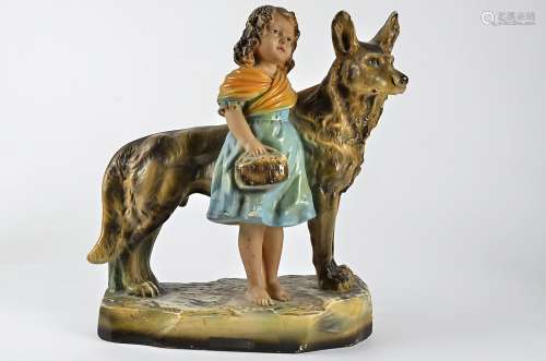 An early 20th Century plaster figure group, of a young girl with a German Shepherd dog, height ,