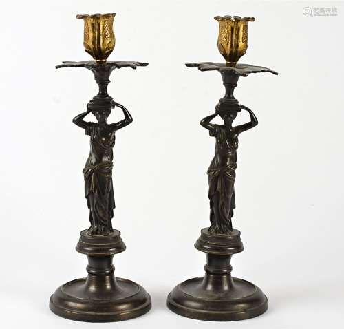 Metalwork figural candlestick holders, taking the form of classical ladies holding vessels above