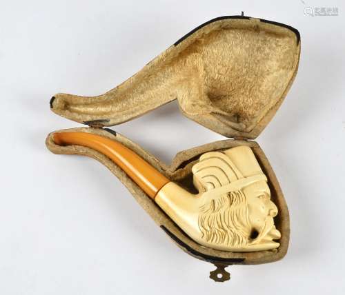 A late 19th Century meerschaum pipe, carved as a figural head, with a yellow possibly amber