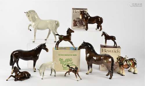 A collection of Beswick horses, to include a white horse with front leg raised upwards, height 19cm,