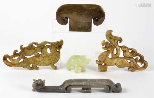 A small collection of Chinese boneite and soapstone carvings, including a companion pair of