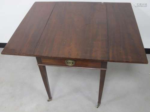A Georgian mahogany Pembroke table, single drawer to one end, raised on tapering supports,