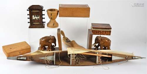 A model of a junk, together with various items of treen, including a pair of elephant book ends