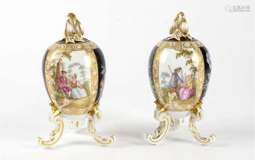 A pair of KPM porcelain ovoid jars and covers, with naturalistic finial, alternating cartouches of