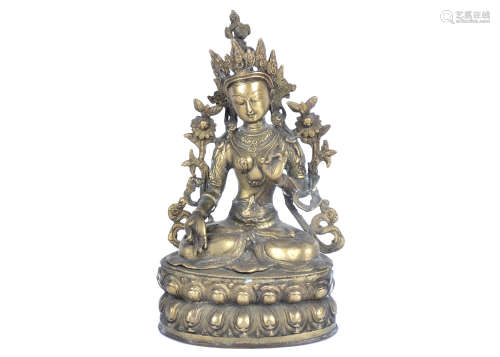A metalwork figure of an Indian Goddess, seated with legs crossed and thumb and forefingers