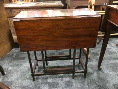 A 19th Century mahogany spider leg table, the rectangular top with drop leaves supported on six