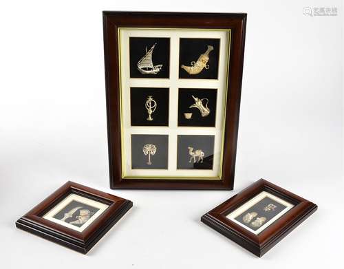 Nine silver Arabic miniatures, modelled as ships, animals, weapons and more, framed and glazed (9)