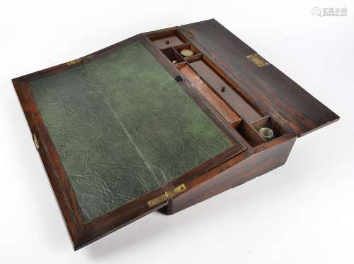 A Victorian rosewood writing slope, with brass inlays, fitted interior containing two lidded glass