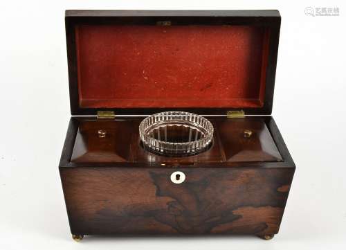 A Victorian rosewood tea caddy, sarcophagus shaped with a mother of pearl escutcheon, the hinged lid