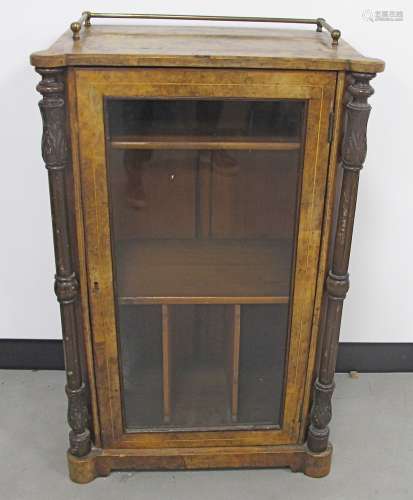 An Edwardian walnut and satin strung music cabinet, with glazed front panelled door, between
