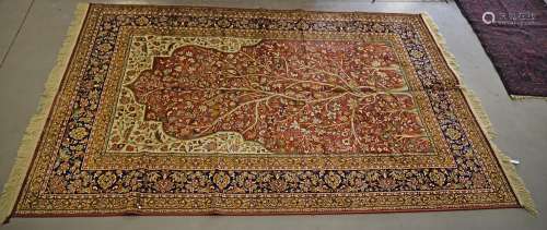 A brushed cotton machine-made rug, tree of life design on terracotta ground, ivory foliate