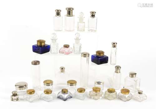 A large quantity of 20th Century glass lidded bottles, square, cylindrical and circular examples